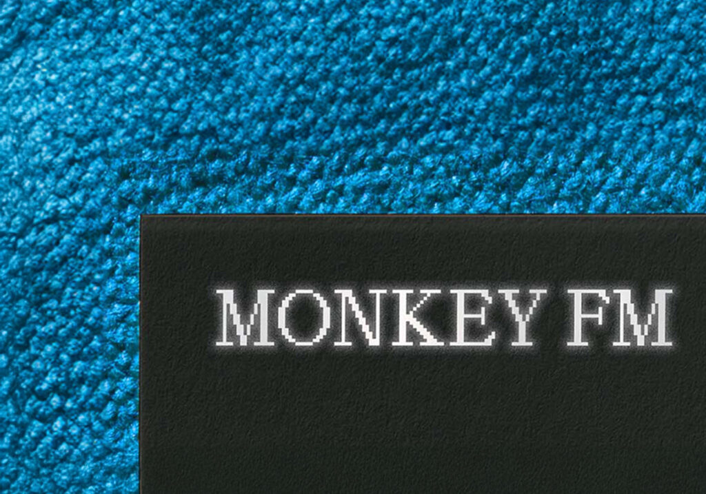 a close up of the silver lettering used on the black business card