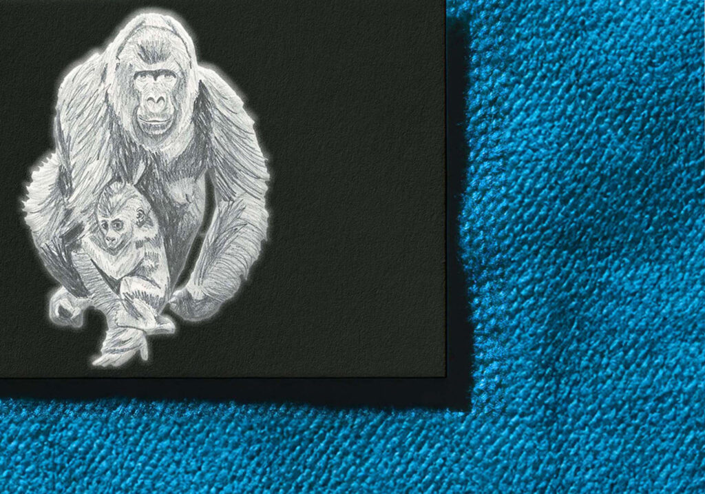 a close up of a running gorilla mum and her kid drawn in pencil on a black business card
