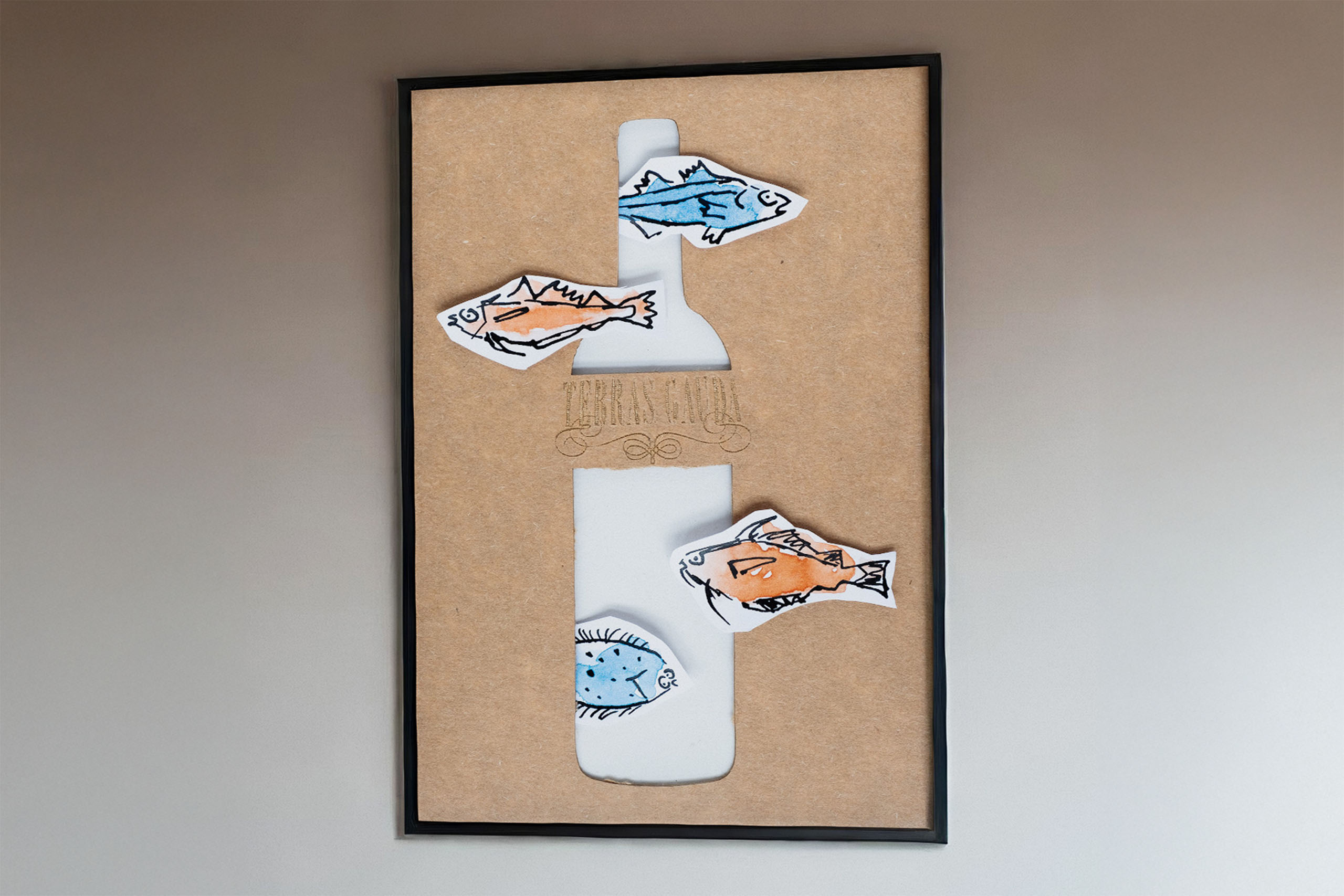 a poster with fish drawn in ink and a laser cut bottle for the wine make Terras Gauda