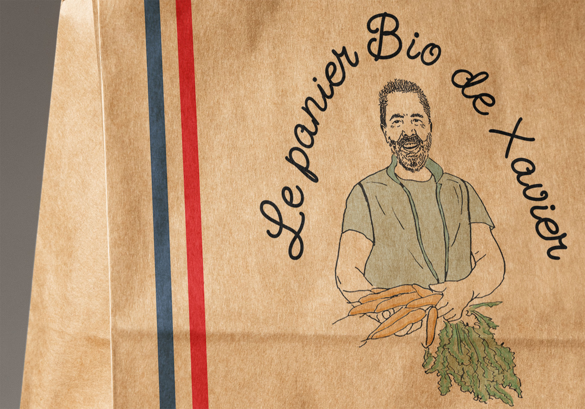close up of the paper bag with on it a drawing of a farmer holding carottes and the title Le panier Bio de Xavier 