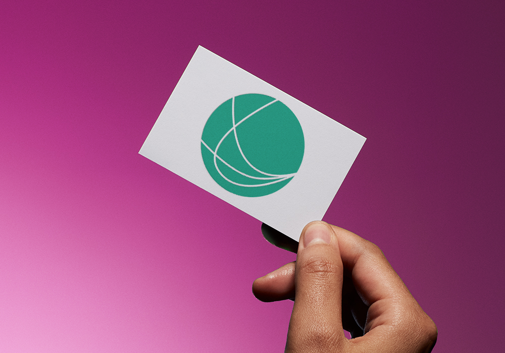 business card with a green logo in the shape of a ball